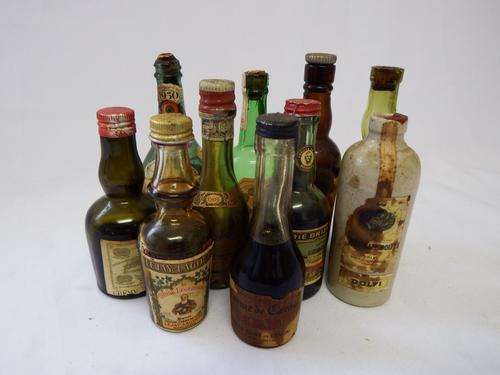 Lot of 10 miniature liquor bottles - most still sealed - most of contents evaporated