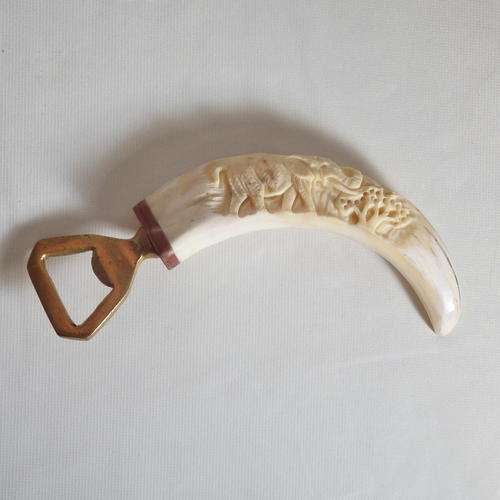 Warthog tooth with brass bottle opener - with elephant carving