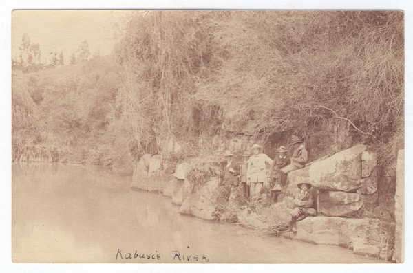 Postcard - Six men posing at Kabusie River - unused