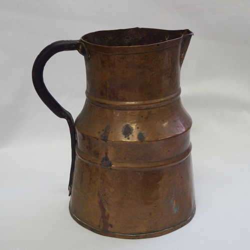 Very old repaired copper jug