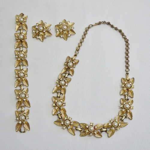 Beautiful Gold colour necklace, bracelet and clip on earrings with imitation pearls and diamonds