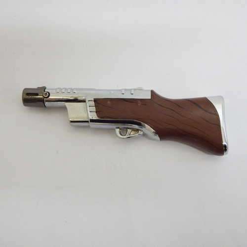 Vintage Rifle shaped electric lighter - not working, leaks gas when refilled