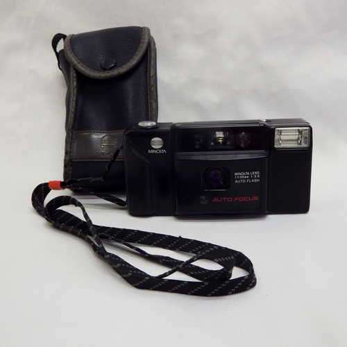 Minolta AF-E Auto - focus instant camera with built in flash in bag