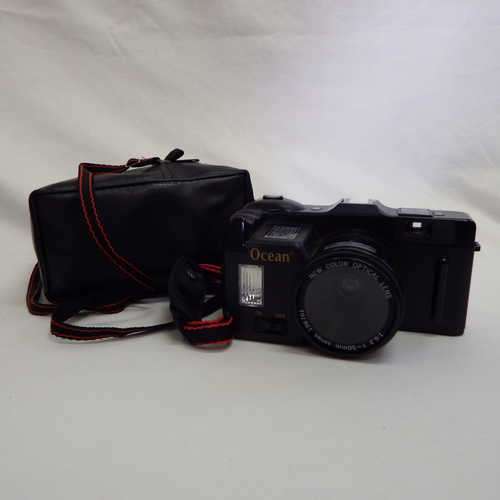 Unusual Ocean film camera with 50mm lens in pouch