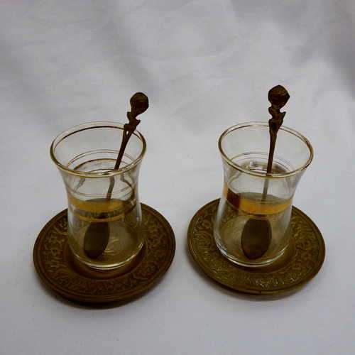 Set of 2 Arabian tea cups and brass saucers plus two brass spoons