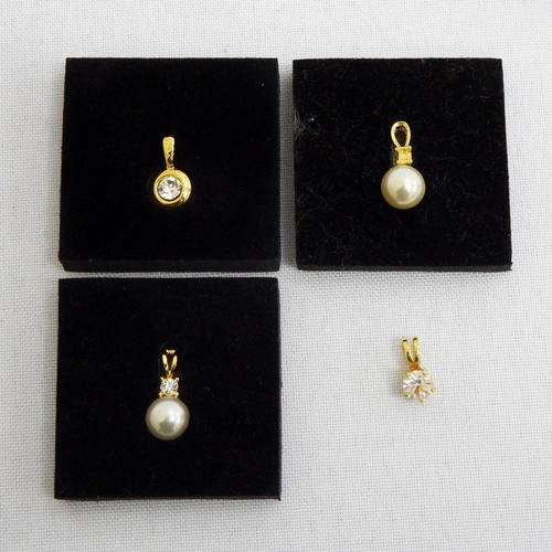 Lot of 4 costume jewellery pendants