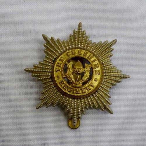 The Cheshire regiment cap badge with slide - 1922 onwards