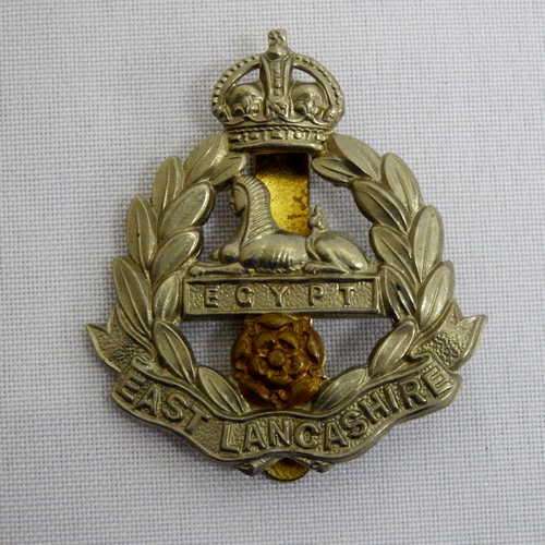 East Lancashire Regiment cap badge with slide - King`s crown