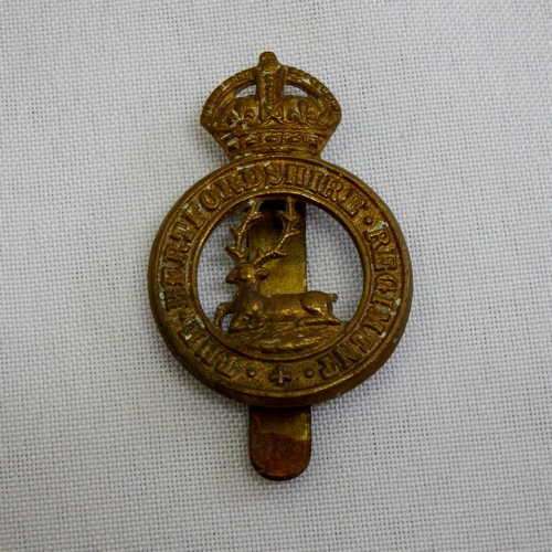The Hertfordshire regiment cap badge with slide - king`s crown