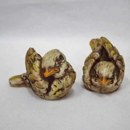 Pair of conglomerate wasn'ts (Mossie) bird figurines