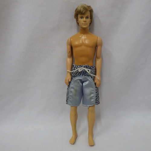Mattel Inc. Ken doll with blond hair and blue eyes - Bendable legs (Shorts damaged at back)