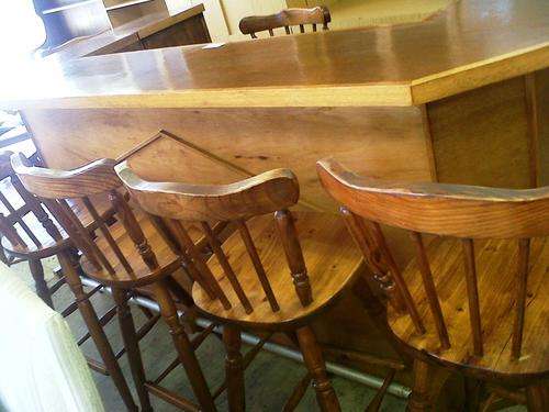 Large wooden bar with 8 bar stools