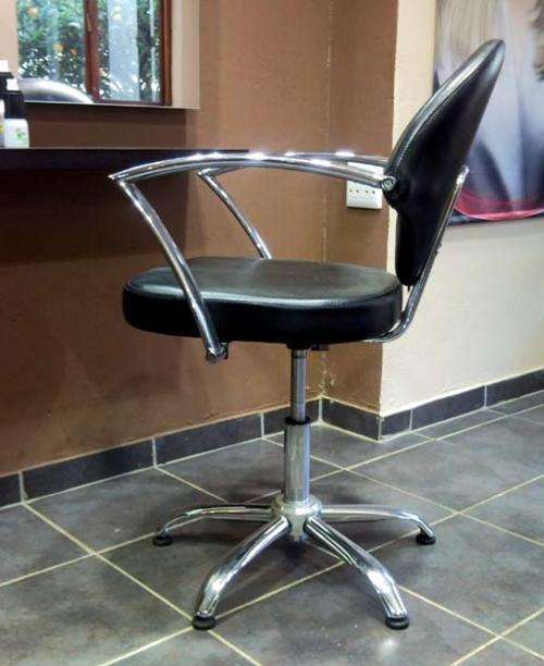 gas-lift salon chairs, black pleather chromed arms