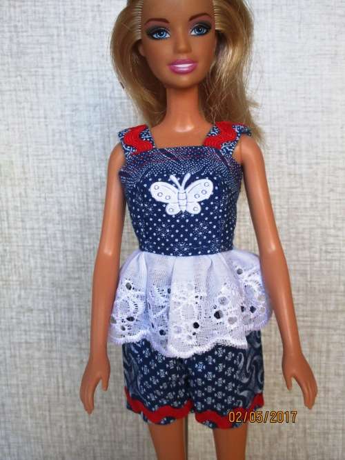 Barbie shorts, top, beach bag and bathing costume.