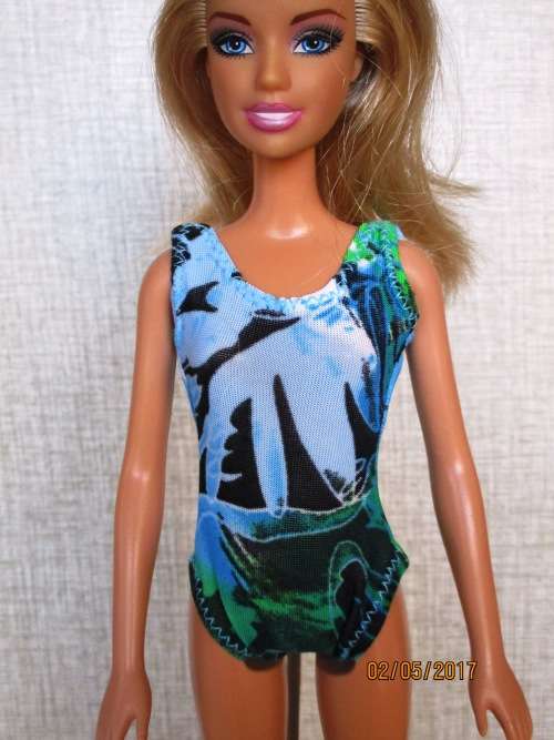 Barbie shorts, top, beach bag and bathing costume.
