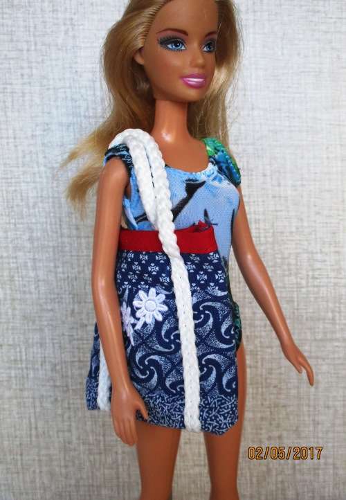 Barbie shorts, top, beach bag and bathing costume.