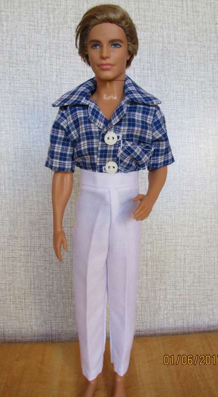 Ken - Barbie white fitted pants with collared button through blue check shirt.