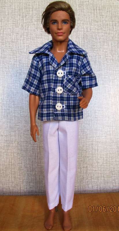 Ken - Barbie white fitted pants with collared button through blue check shirt.