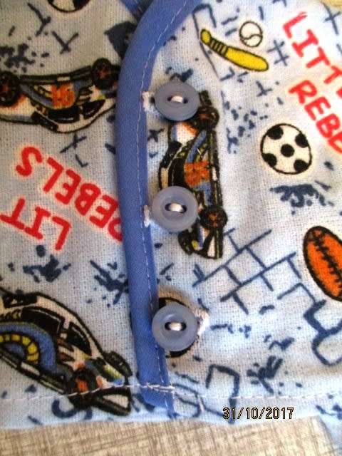 Ken - Barbie - winter PYJAMAS in blue sports print with blue binding.