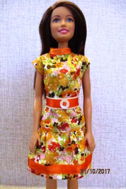 Barbie DRESS with belt n orange print.