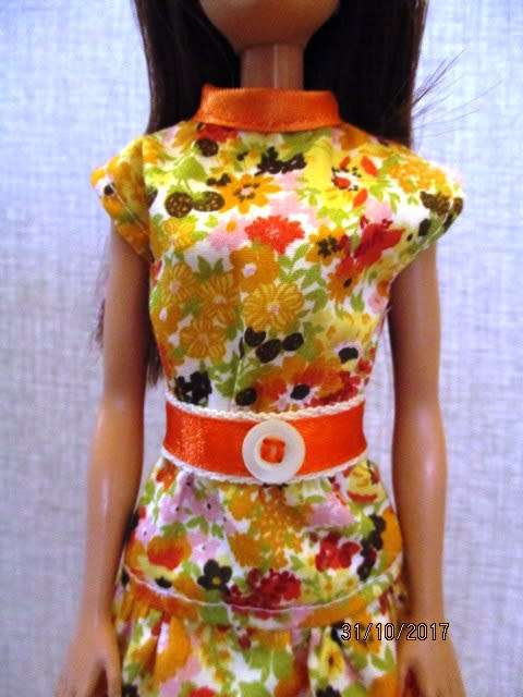 Barbie DRESS with belt n orange print.