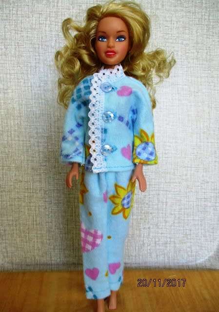 Barbie generic doll plus outfits.