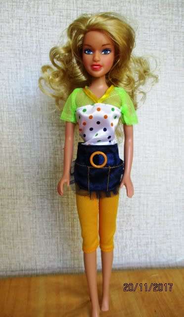Barbie generic doll plus outfits.