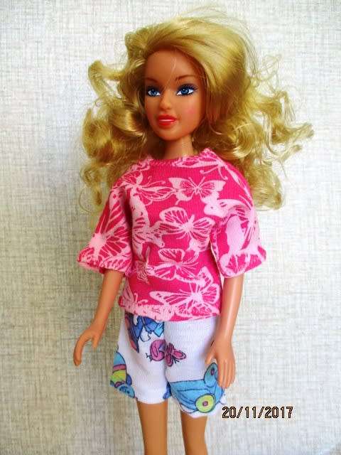 Barbie generic doll plus outfits.