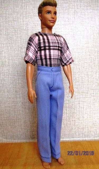 Ken - Barbie - fitted blue pants with pink/black check T-shirt.