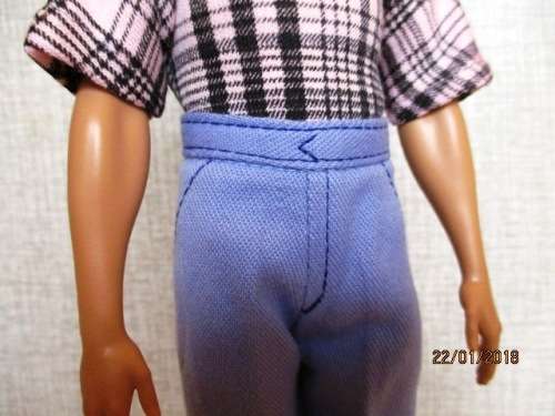 Ken - Barbie - fitted blue pants with pink/black check T-shirt.