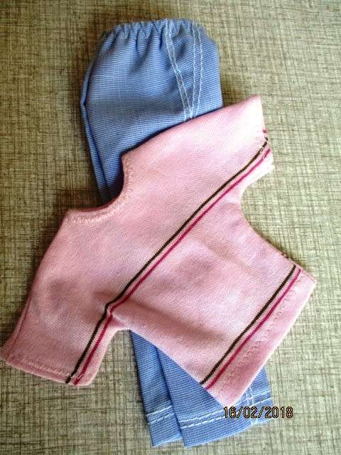 Ken - Barbie - light blue PANTS with pink stripe T-SHIRT.