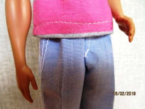 Ken - Barbie - light blue pants plus pink and grey stripe T-shirt.