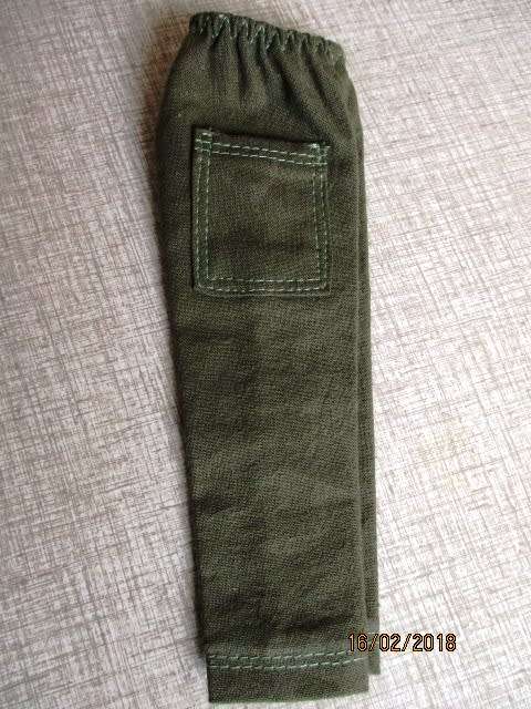 Ken - Barbie - doll's olive green cargo pants and camouflage T-shirt.