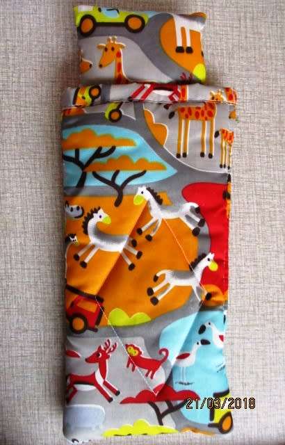 Ken sleeping bag in bright safari print.