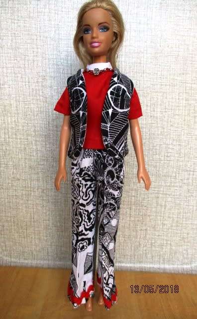 Barbie doll's black and white print pants with red shirt (attached necklace)