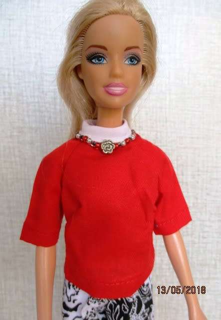 Barbie doll's black and white print pants with red shirt (attached necklace)