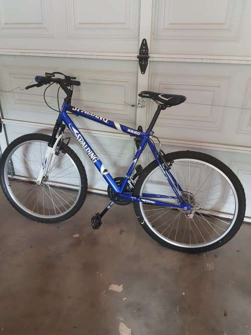 2 Spalding bicycles( his and hers) with 3 helmets and repair kit