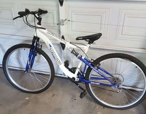 2 Spalding bicycles( his and hers) with 3 helmets and repair kit