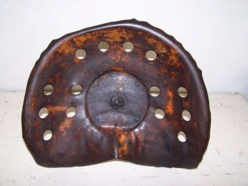 a tractor seat...with loads of character !!!