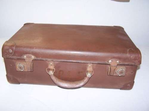 suitcase ... a brown one of the school variety !!!