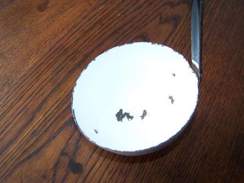 ladle ...  a heavy white one !!!