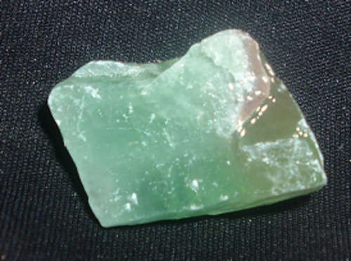 Rough green calcite draws money and prosperity