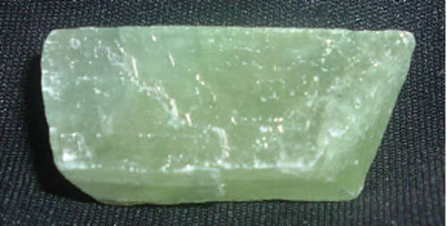 Rough green calcite draws money and prosperity