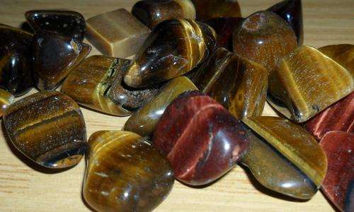 12 TIGERS EYE TUMBELED STONES :PROTECTIVE STONE ELIMINATES THE "BLUES "AND BRINGS OPTIMISM