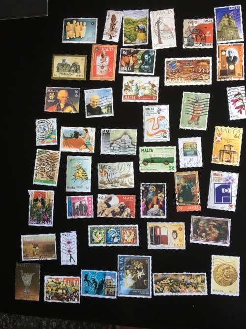 43 used Malta stamps on a stock card
