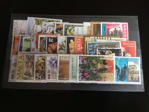 43 used Malta stamps on a stock card
