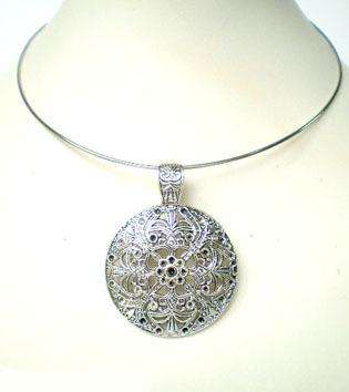 STUNNING ROUND TIBETAN SILVER AMULET ON CHOKER