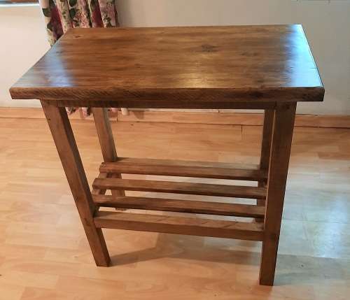 Chopping block table made of stained pine