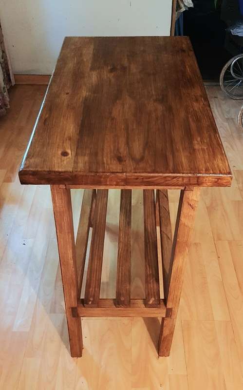 Chopping block table made of stained pine