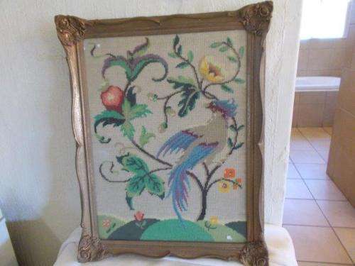Stunning framed bird tapestry behind glass in ornate frame
